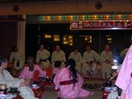 Men lined up in their yukatas