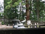 Crane and statues around Ieyasu's tomb - Nikko